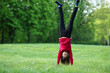 © Елена Кравчук - Upside down handstand happy smile sport young woman outdoor, green park, grass, full lenght