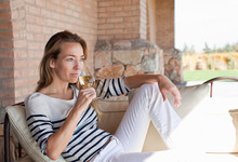 Woman Enjoying Wine On The Terrace