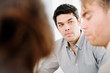 © Connect Images - Man wearing shirt looking at male colleague