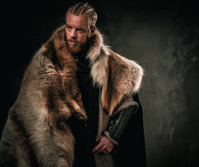 Viking konung in a traditional warrior clothes