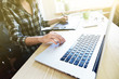 © Ivan Kruk - designers hands with tablet and laptop at table