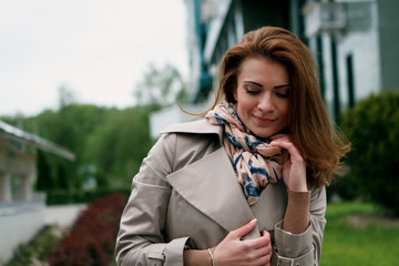 woman in beige coat in the city