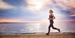 © candy1812 - Young woman running on the beach near seaside at sunset
