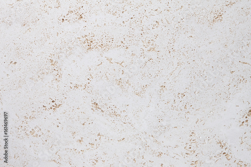 Fototapeta Beige stone background, natural travertine texture close up