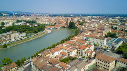 Wall Mural - Aerial video shooting with drone of Verona, city on the Adige river in Veneto famous for Romeo and Juliet a Shakespeare’s play, has been awarded World Heritage Site status by UNESCO