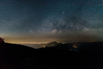 Wall Mural - beautiful sky with many stars above the mountain , milky way band across the sky.