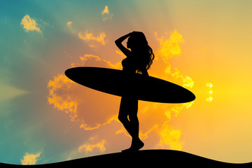 Wall Mural - girl with surf at sunset