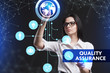 © photon_photo - The concept of business, technology, the Internet and the network. A young entrepreneur working on a virtual screen of the future and sees the inscription: Quality assurance