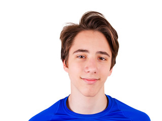 Handsome teen boy  looking at camera. Portrait of teenager in blue T-shirt. Happy guy smiling, isolated on white background