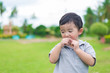 © pookpiik - Little Asian kid at the playground under the sunlight, shallow DOF