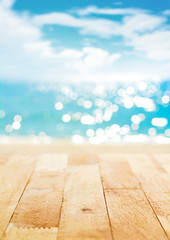 Wall Mural - Wood table top on blur summer beach and sunny sky background