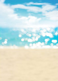 Fototapeta Morze - Blur summer white sand beach with sparkling sea water