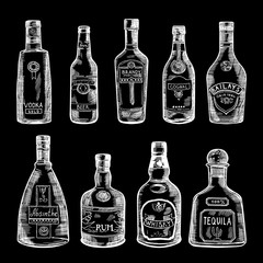 Wall Mural - hand drawn illustration of different bottles isolate on dark background. vector pictures set