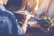 © Panumas - Business peoples meeting and passing money for new business project on table. investment concept