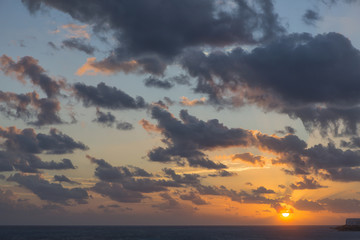 Wall Mural - Beautiful sunrise over the Caribbean sea with dramatic sky formations.