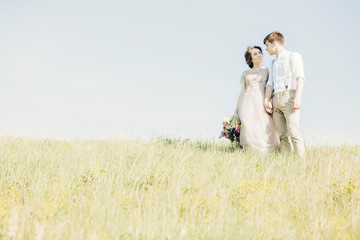 Wall Mural - wedding couple on  nature.  bride and groom hugging at  wedding. 