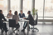 © alfa27 - male african Manager Leads Brainstorming Meeting In Design Office