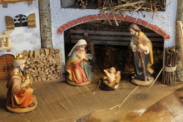 Wall Mural - Traditional nativity scene with the Holy Family and the baby Jes