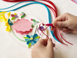 © Dmitry - Decorate with strips of paper, quilling .Hands child while creative work making decorations by quilling paper