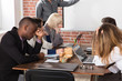 © Andrey Popov - Tired Young Businesspeople Bored During Meeting