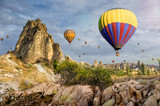 Fototapeta  - Hot air balloon flying over rock landscape at Cappadocia Turkey