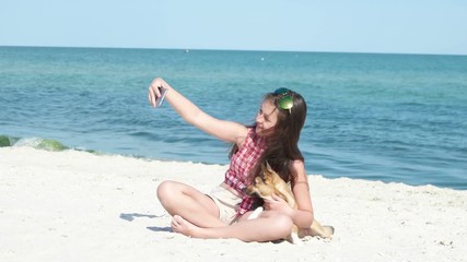 Wall Mural - Teen girl doing selfie on the sea beach