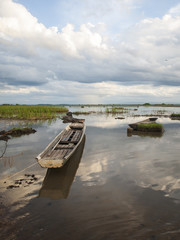 Naklejka na meble Beautiful sunrise and Fishing boat in countryside.