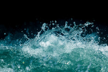 Splash Of Stormy Water In The Ocean On A Black Background