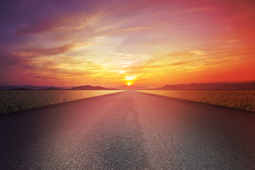 Bicycle road on field a Sunset