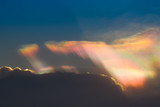 Fototapeta Na ścianę - Color through clouds in the evening sky.