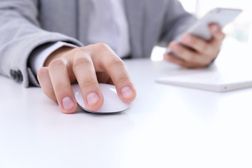 Canvas Print - Male hand with computer mouse on table