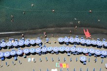 Aerial View Of Parasols And Lounge Chairs At Beach