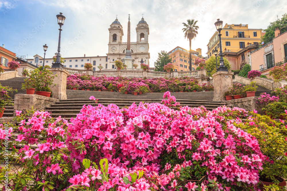 Spanish Steps in the morning with azaleas in Rome, Italy. Rome Spanish Steps (Scalinata della Trinità dei Monti) are a famous landmark and attraction of Rome and Italy. - obrazy, fototapety, plakaty 