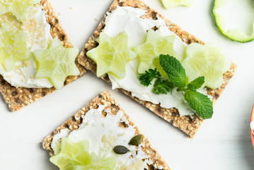 Wall Mural - Snack from Wholegrain Rye Crispbread Crackers and Cucumber