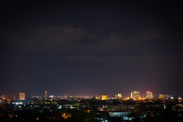 Wall Mural - landscape city night with dramatic moody dark sky