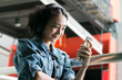 © irocket - young beautiful woman using smartphone and  listening music with headphones