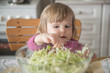© poplasen - Little girl picking at cabbage from salad bowl
