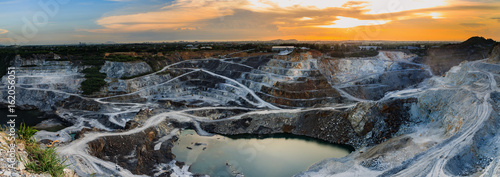 Fotografía panorama of the quarry mining with beautiful sunlight and cloudy sky Aerial view