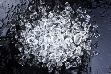 Wall Mural - crushed ice on black background. top view
