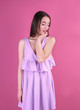 © Africa Studio - Beautiful young woman in lilac dress on color background