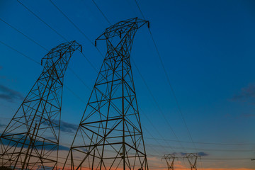 Background of the high-voltage tower the sunset in skyline