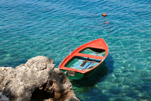 Small Orange Boat In Adriatic Sea In Brela , Croatia 