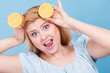 Girl holding lemon citrus fruit