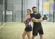 © FotoAndalucia - Smiling couple in paddle tennis court posing