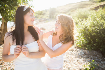 Best friend girls on the sunny beach. Crazy emotions, happy vacations