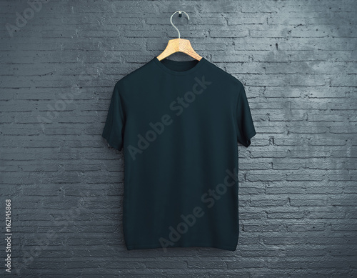 Cuadros en Lienzo Black t-shirt on brick background
