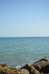 Wall Mural - Sunny panoramic view of the ocean with rocks, seascape natural outdoors background