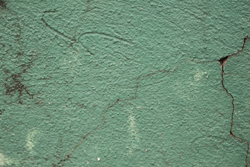 Sticker - Green painted wall with cracks photo texture. Cement wall with stains and grit closeup.