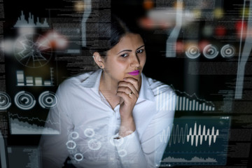 woman looking at futuristic interface screen.