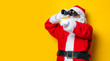 © Masson - Funny Santa Claus holding binoculars